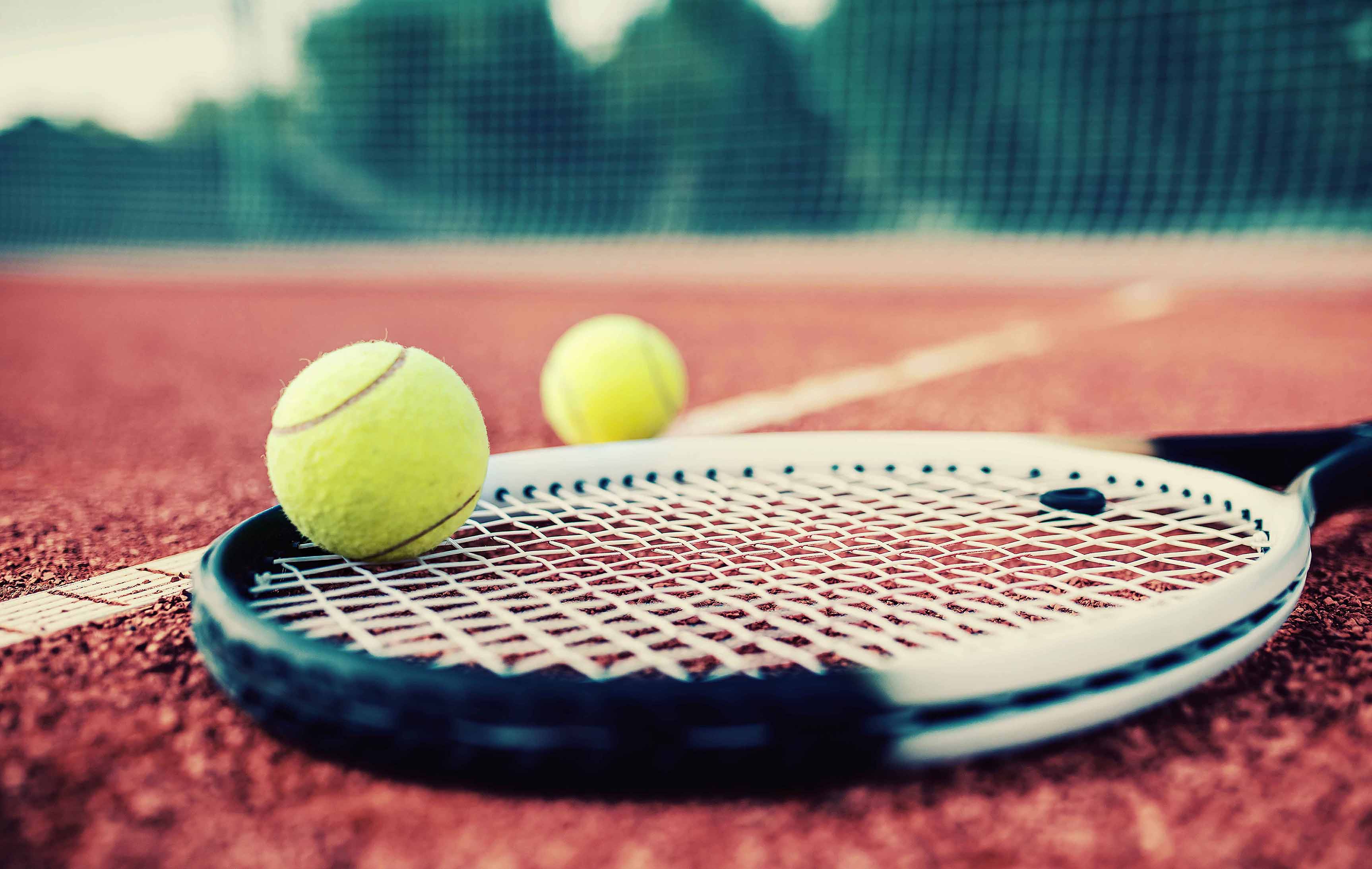 tennis equipment sitting on a court