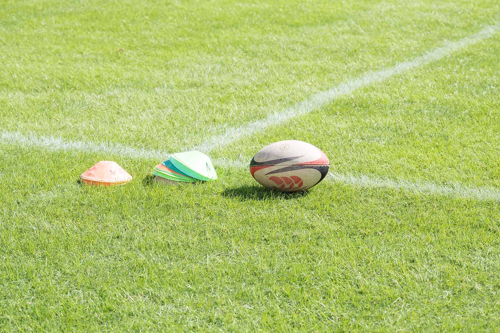 Rugby equipment on field 