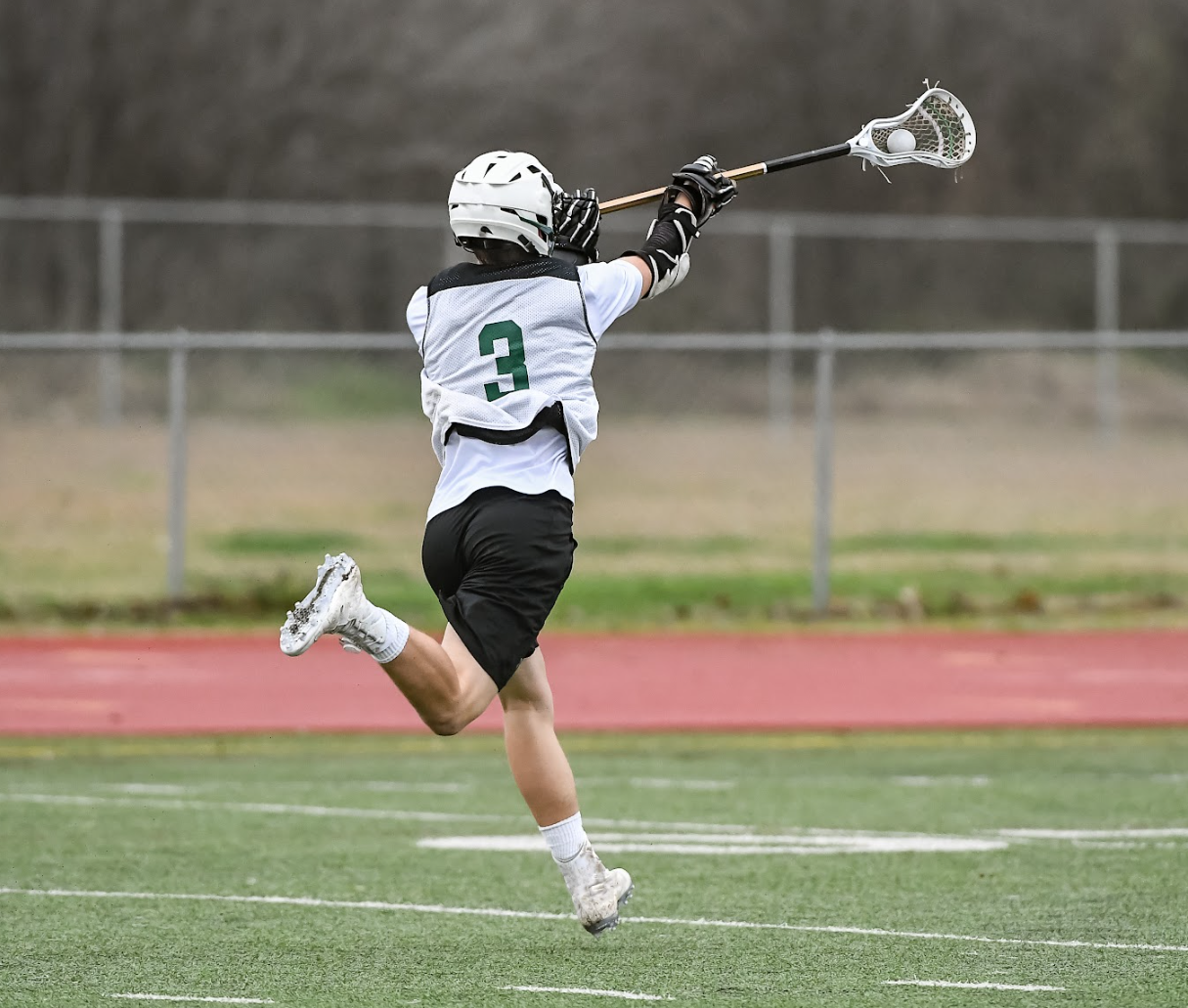 A person playing lacrosse