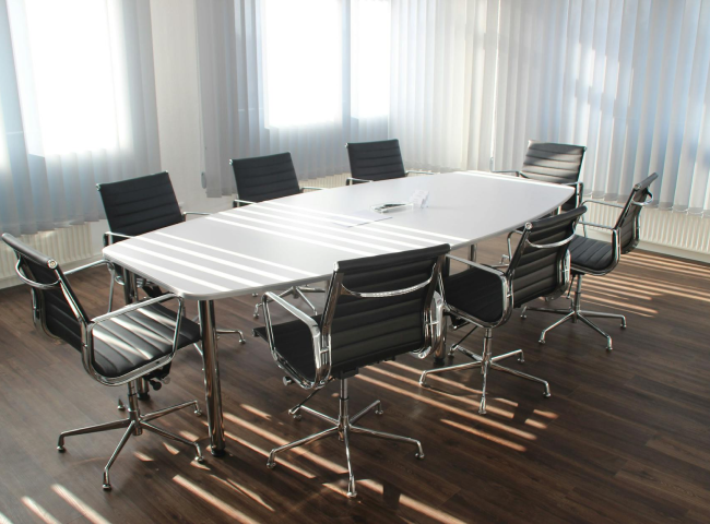 a conference table with chairs all around it