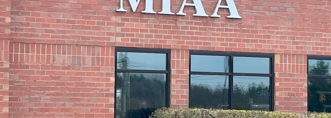 Exterior of a brick building with the lettering MIAA
